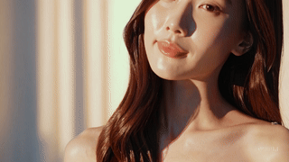 Radiant woman showcasing glass skin in natural light for Riman Skincare beauty inspiration.