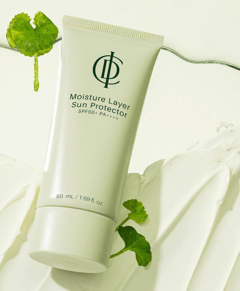 ICD Moisture Layer Sunscreen tube with SPF 50+ on a creamy background, showcasing hydration and skin protection.