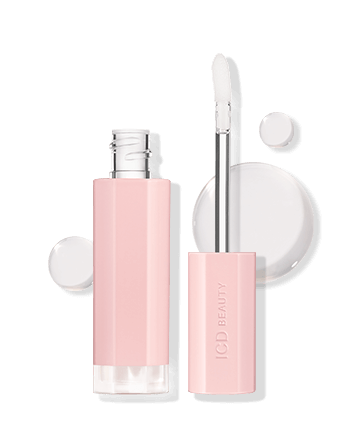 ICD Beauty Glow Up Lip Oil in pink packaging with applicator, providing shimmering lip nourishment and hydration.