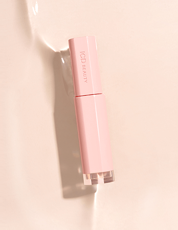 ICD Beauty Glow Up Lip Oil in a sleek pink tube, perfect for all-day lip care and overnight hydration.