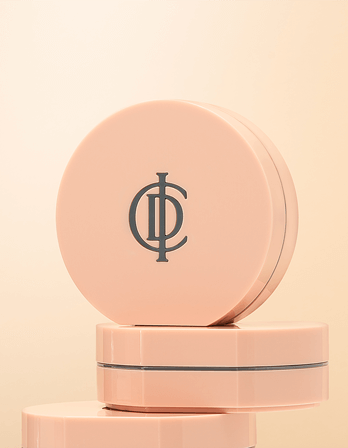ICD Makeup Luminous Glow Cushion in elegant pink packaging, showcasing the logo on a minimalist background.