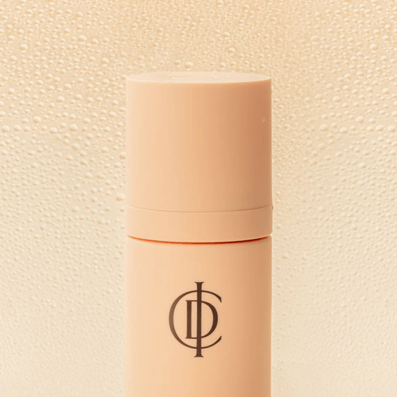 ICD Makeup Setting Spray bottle with logo, featuring a gentle mist for long-lasting makeup and skin hydration.