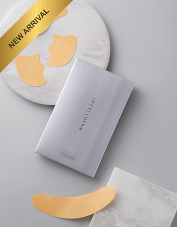 New arrival Incelloderm eye patches in sleek silver packaging with golden patches on a marble surface.