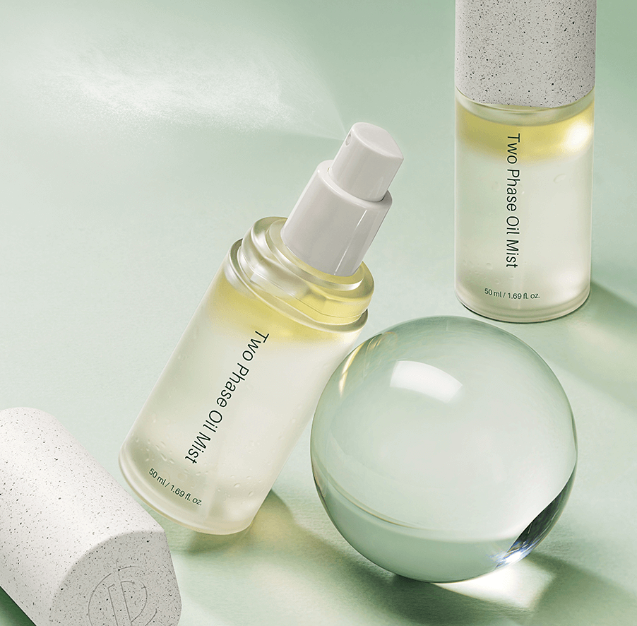 Minimalist image of Two-Phase Oil Mist bottle highlighting dual-phase formula – Korean facial mist for dewy skin
