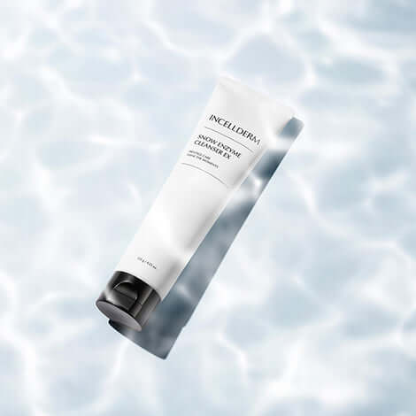 Incellderm Snow Enzyme Cleanser EX tube on water surface, featuring gentle foaming cleanser for clean and hydrated skin.