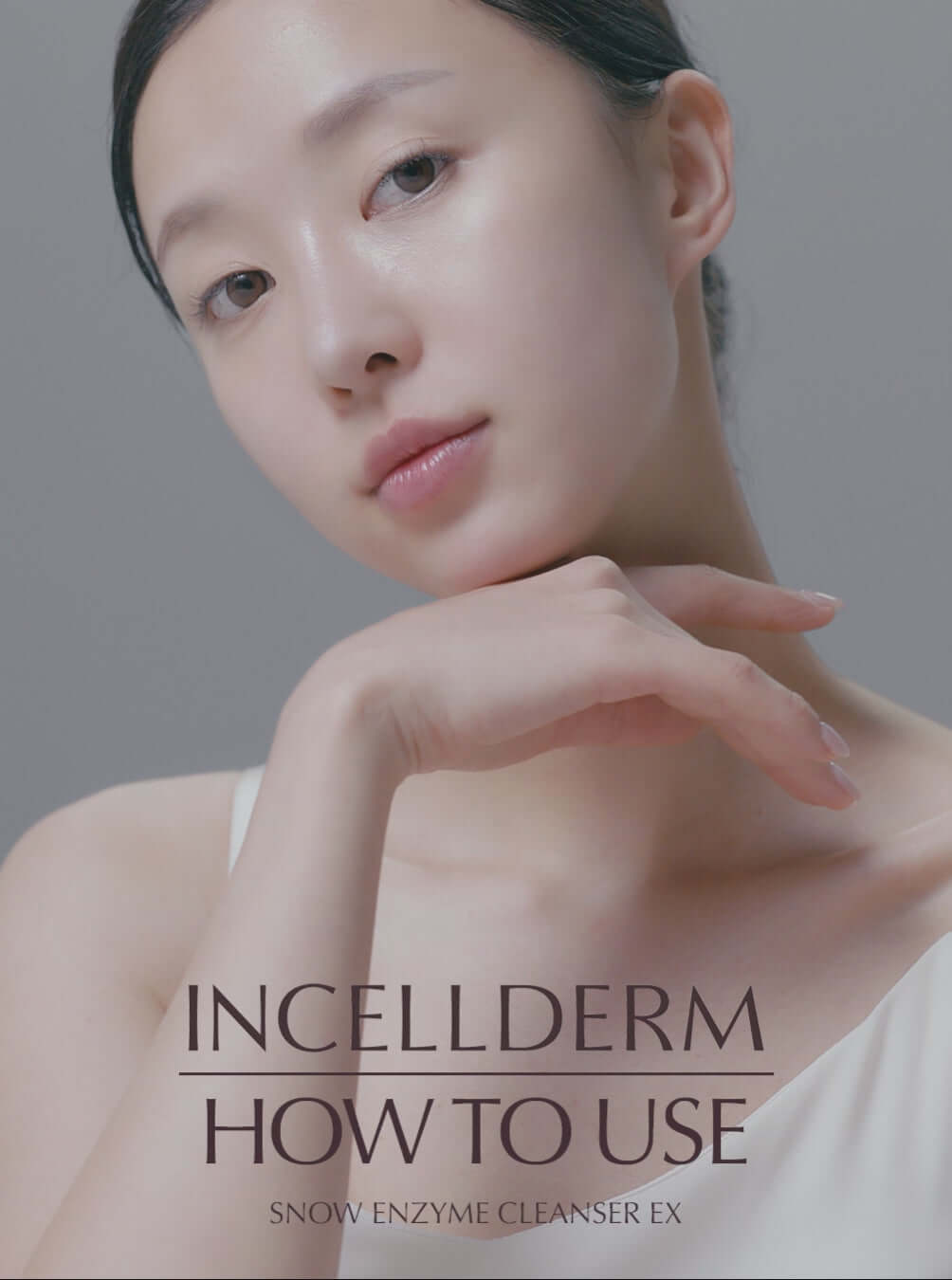 Model demonstrating how to use Incellderm Snow Enzyme Cleanser EX for effective skin cleansing.