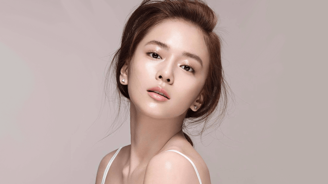 Radiant woman with flawless skin showcasing beauty and confidence, highlighting the effects of quality skincare and makeup.